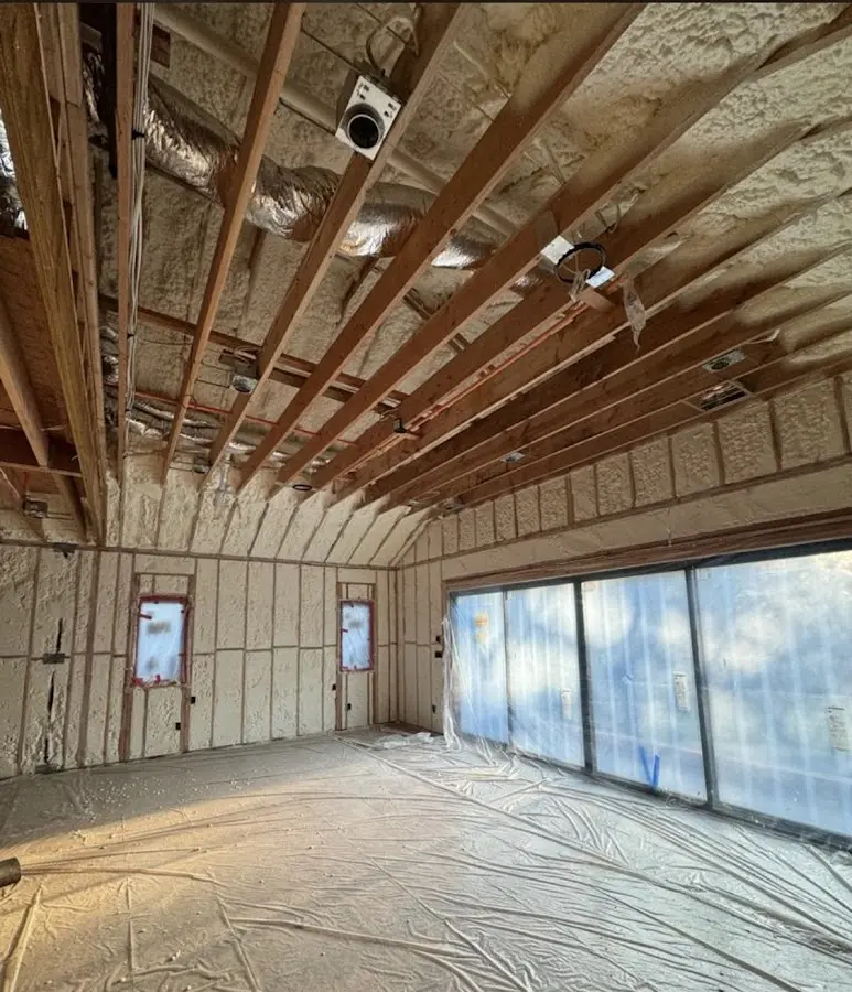 Interior walls and ceiling insulated with spray foam during new construction in West Columbia